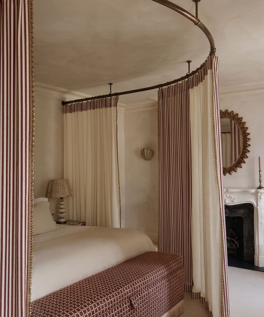 Corona bed canopy with striped reversible curtains lined in a contrasting fabric